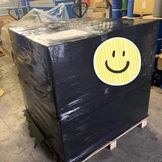 A piano wrapped ready for removal